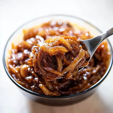 Sweet and golden strands of caramelized onions, ready to top recipes.